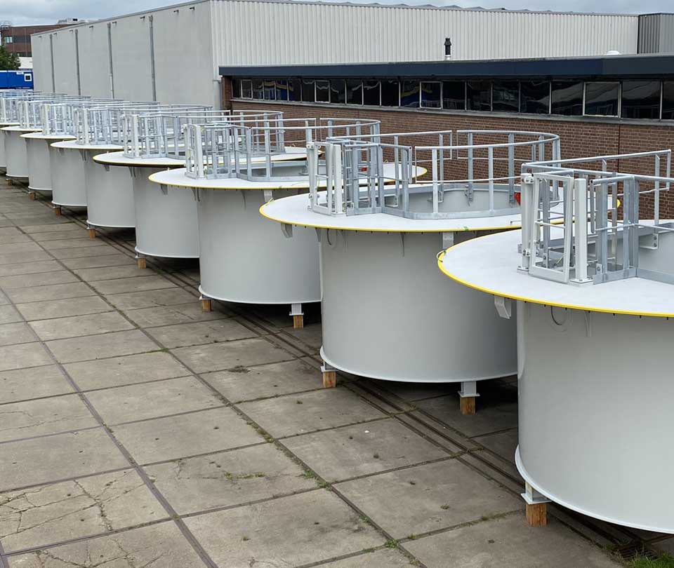 man painting a turbine base